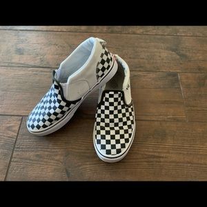 Black and white checkered Vans sneakers